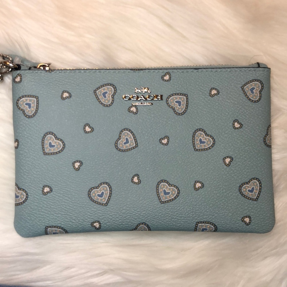 Blue Coach wristlet with hearts